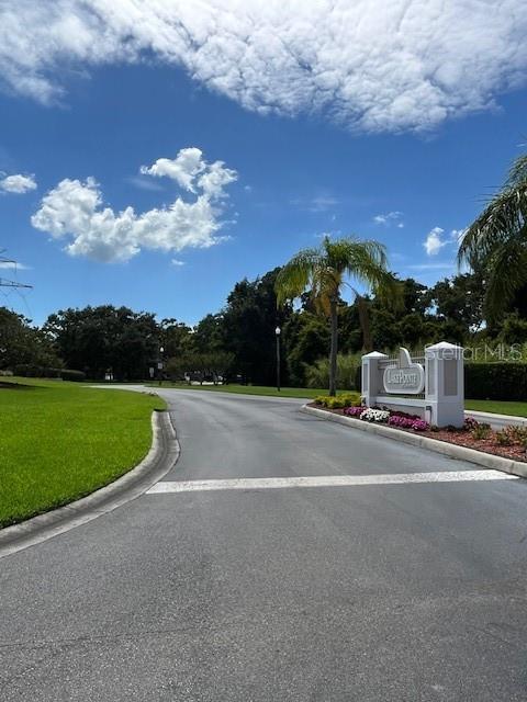 3665 Country Pointe Pl, Palm Harbor, FL 34684 - view of asphalt road with curbs
