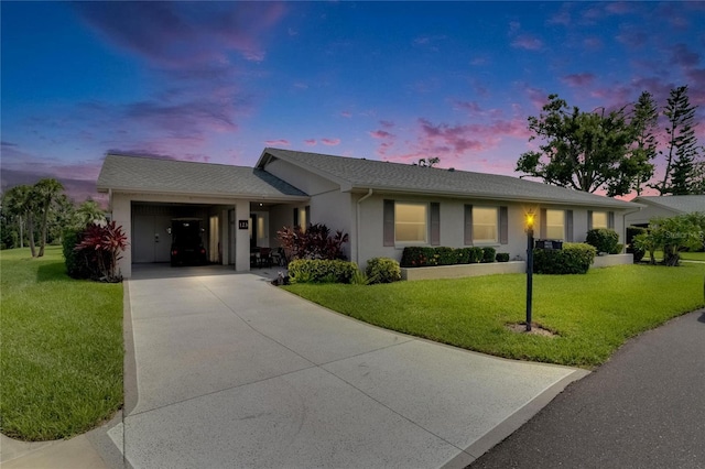 123 Glendower Cir Unit 123, Sun City Center, FL 33573 - ranch-style house with a yard, driveway, stucco siding, and a garage