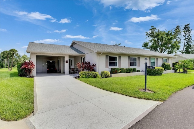 123 Glendower Cir Unit 123, Sun City Center, FL 33573 - ranch-style home featuring a front yard, driveway, and stucco siding