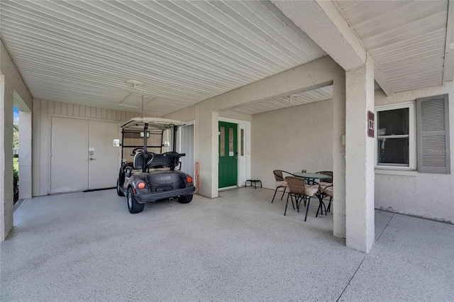 123 Glendower Cir Unit 123, Sun City Center, FL 33573 - view of patio / terrace featuring outdoor dining area and a carport