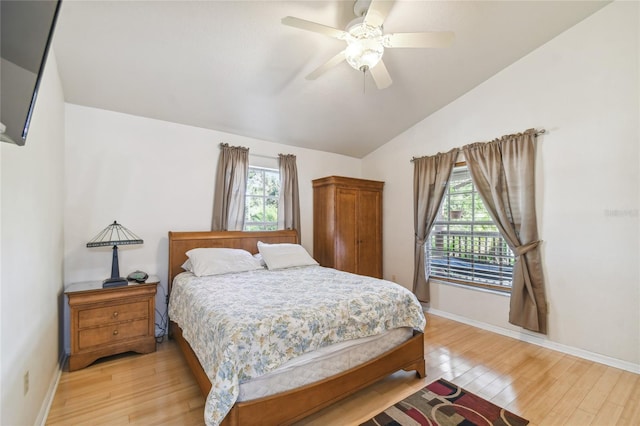 5908 Mohr Rd, Tampa, FL 33615 - bedroom featuring light wood finished floors, vaulted ceiling, and ceiling fan