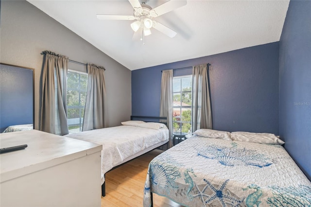 5908 Mohr Rd, Tampa, FL 33615 - bedroom with lofted ceiling, wood finished floors, and ceiling fan