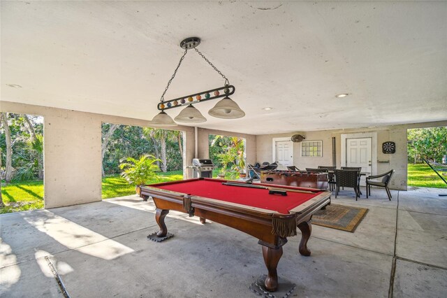 5908 Mohr Rd, Tampa, FL 33615 - recreation room with unfinished concrete flooring and billiards table