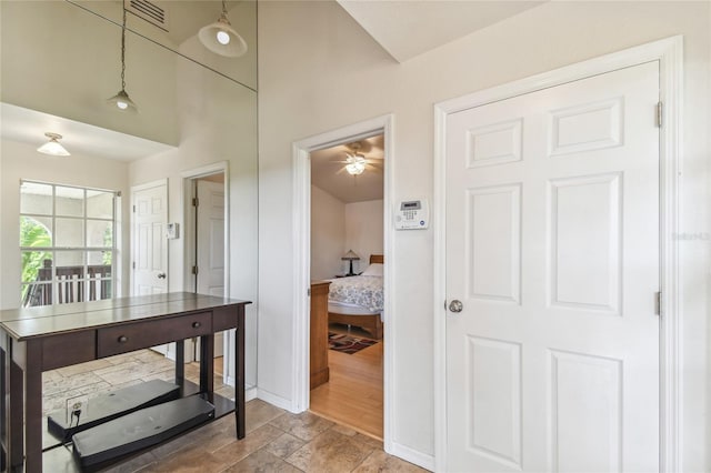 5908 Mohr Rd, Tampa, FL 33615 - corridor featuring stone finish flooring and baseboards