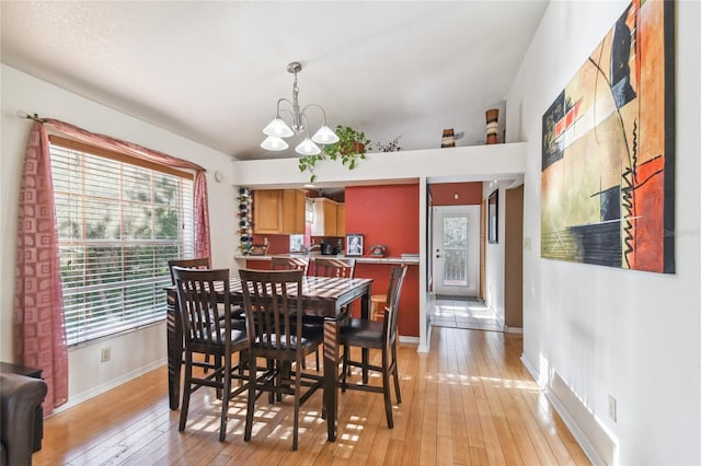 5908 Mohr Rd, Tampa, FL 33615 - dining space with a chandelier and light wood-style floors