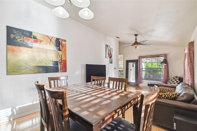 5908 Mohr Rd, Tampa, FL 33615 - dining room with light wood-style floors, vaulted ceiling, and a ceiling fan