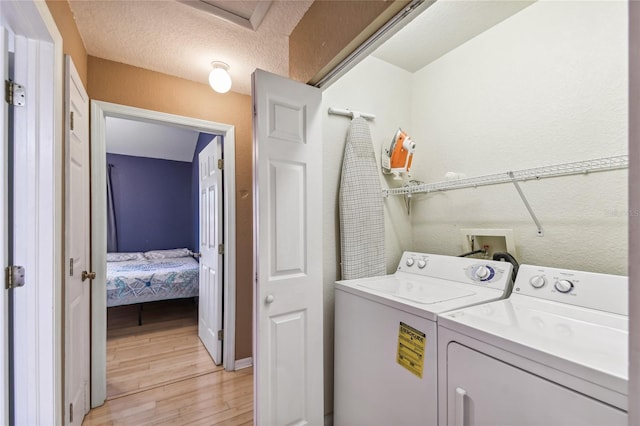 5908 Mohr Rd, Tampa, FL 33615 - washroom featuring independent washer and dryer and light wood-style flooring