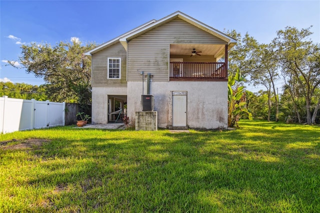 5908 Mohr Rd, Tampa, FL 33615 - rear view of property featuring ceiling fan, stucco siding, and a fenced backyard