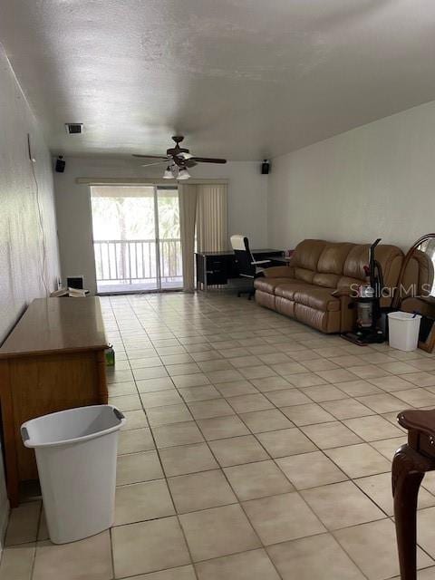8636 Tahoe Ct Unit 13, Tampa, FL 33614 - living room featuring light tile patterned floors and ceiling fan