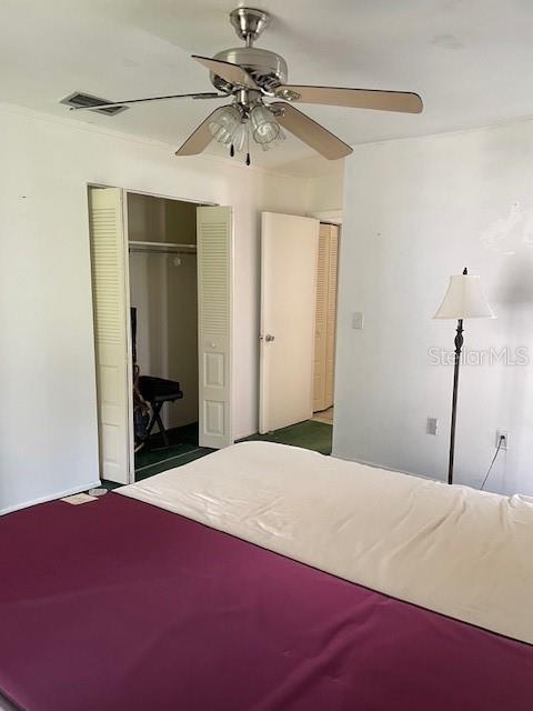 8636 Tahoe Ct Unit 13, Tampa, FL 33614 - bedroom featuring a closet and a ceiling fan