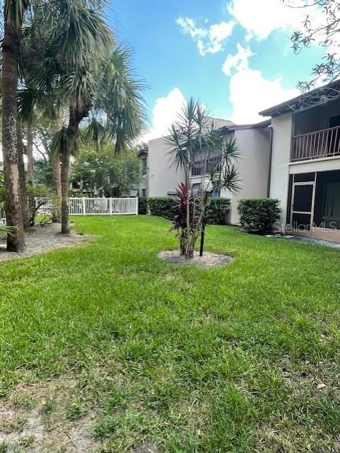 8636 Tahoe Ct Unit 13, Tampa, FL 33614 - view of yard featuring a balcony