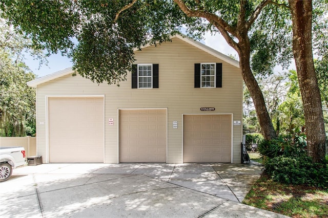 11945 Darwin Ave, New Port Richey, FL 34654 - view of front facade with a garage