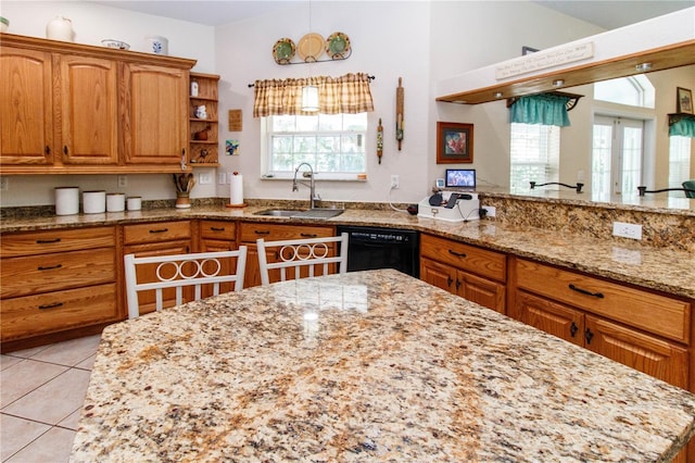11945 Darwin Ave, New Port Richey, FL 34654 - kitchen featuring dishwasher, light stone countertops, light tile patterned floors, brown cabinetry, and open shelves