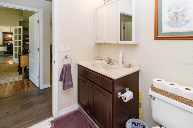11945 Darwin Ave, New Port Richey, FL 34654 - bathroom with vanity and wood finished floors
