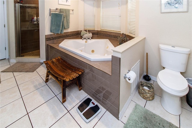 11945 Darwin Ave, New Port Richey, FL 34654 - full bath featuring a tub with jets, a stall shower, and tile patterned flooring