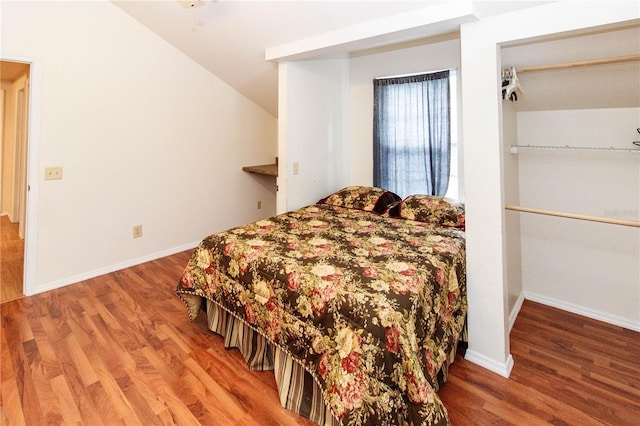11945 Darwin Ave, New Port Richey, FL 34654 - bedroom with wood finished floors and lofted ceiling
