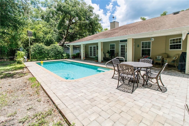 11945 Darwin Ave, New Port Richey, FL 34654 - view of pool featuring french doors and a patio area