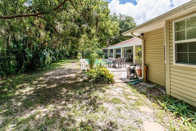 11945 Darwin Ave, New Port Richey, FL 34654 - view of yard with a patio area