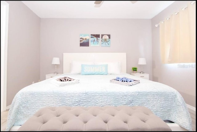 1004 Osage St, Clearwater, FL 33755 - bedroom with baseboards and a ceiling fan