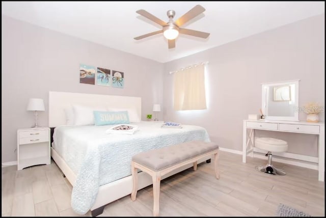 1004 Osage St, Clearwater, FL 33755 - bedroom with light wood finished floors and ceiling fan