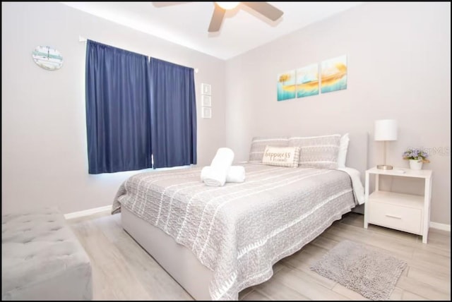 1004 Osage St, Clearwater, FL 33755 - bedroom with ceiling fan and wood finished floors