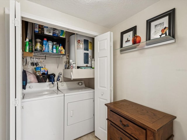 2010 E Palm Ave Unit 14303, Tampa, FL 33605 - laundry room with washer and dryer, water heater, and a textured ceiling