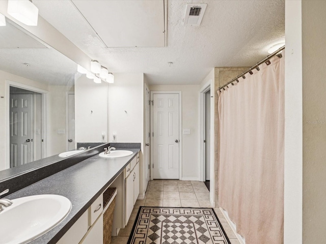 2010 E Palm Ave Unit 14303, Tampa, FL 33605 - bathroom featuring double vanity, curtained shower, and tile patterned floors