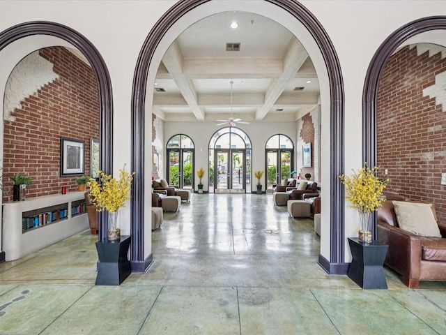 2010 E Palm Ave Unit 14303, Tampa, FL 33605 - building lobby with beam ceiling, coffered ceiling, brick wall, and recessed lighting