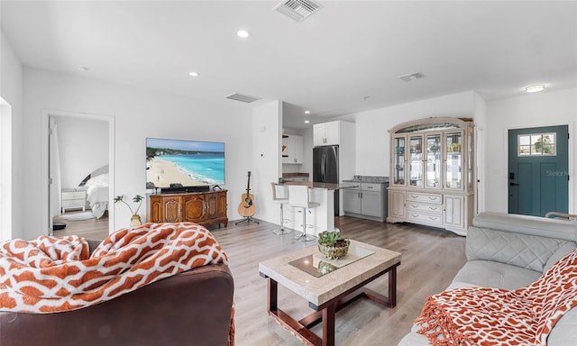 9429 Northcliffe Blvd, Spring Hill, FL 34606 - living room with light wood finished floors and recessed lighting