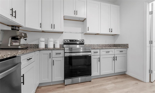 9429 Northcliffe Blvd, Spring Hill, FL 34606 - kitchen featuring stainless steel appliances, light wood-type flooring, stone counters, and white cabinets