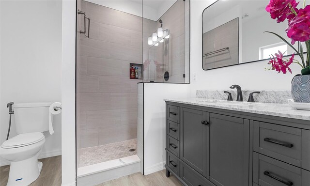 9429 Northcliffe Blvd, Spring Hill, FL 34606 - bathroom featuring vanity, a walk in shower, and wood finished floors