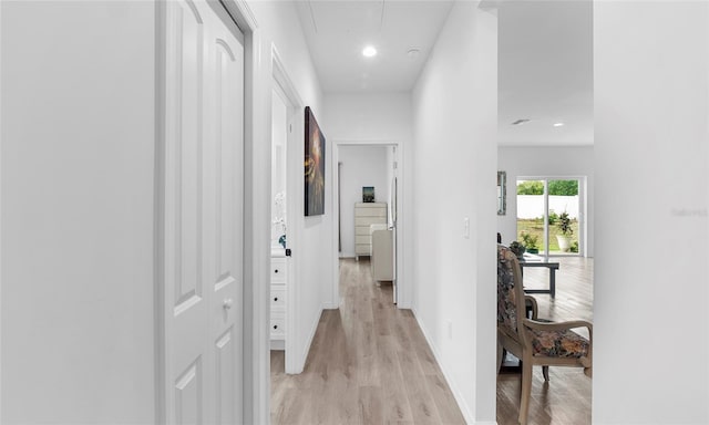 9429 Northcliffe Blvd, Spring Hill, FL 34606 - hallway with light wood-type flooring, attic access, and recessed lighting