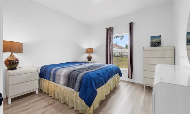 9429 Northcliffe Blvd, Spring Hill, FL 34606 - bedroom with light wood-type flooring and baseboards