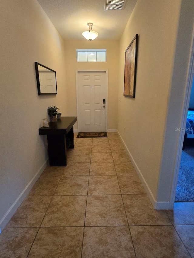 8923 Cuban Palm Rd, Kissimmee, FL 34747 - entryway with tile patterned floors and baseboards
