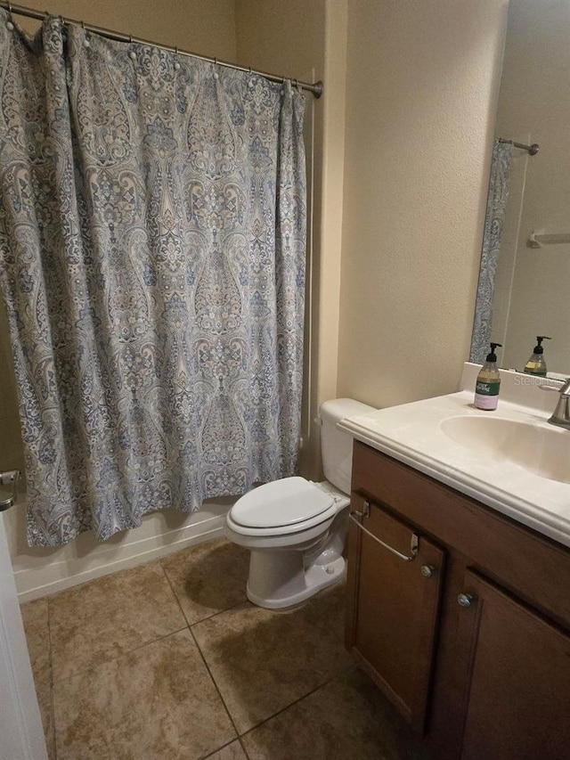 8923 Cuban Palm Rd, Kissimmee, FL 34747 - bathroom with vanity, tile patterned flooring, and shower / tub combo
