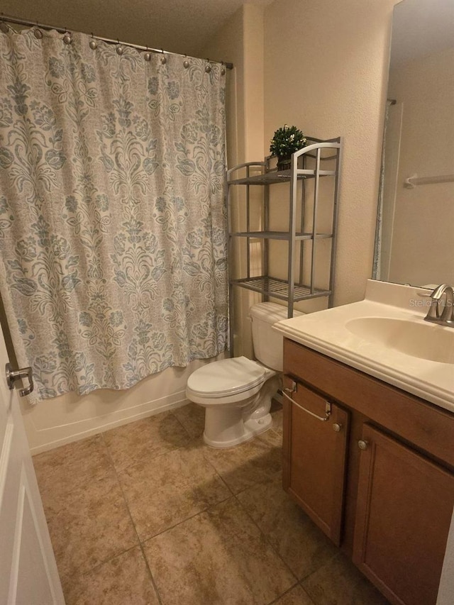 8923 Cuban Palm Rd, Kissimmee, FL 34747 - full bath with vanity, tile patterned floors, and shower / tub combo with curtain