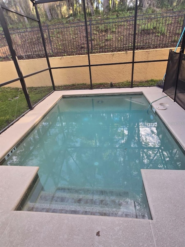 8923 Cuban Palm Rd, Kissimmee, FL 34747 - view of swimming pool with glass enclosure