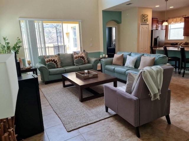 8923 Cuban Palm Rd, Kissimmee, FL 34747 - living area featuring arched walkways and light tile patterned floors