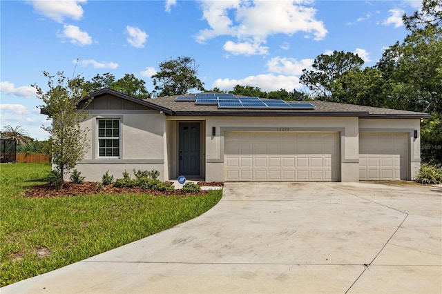 12277 Spring Hill Dr, Spring Hill, FL 34609 - single story home with driveway, a garage, roof mounted solar panels, a front lawn, and stucco siding