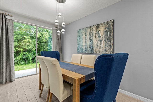 12277 Spring Hill Dr, Spring Hill, FL 34609 - dining space with light wood finished floors and baseboards