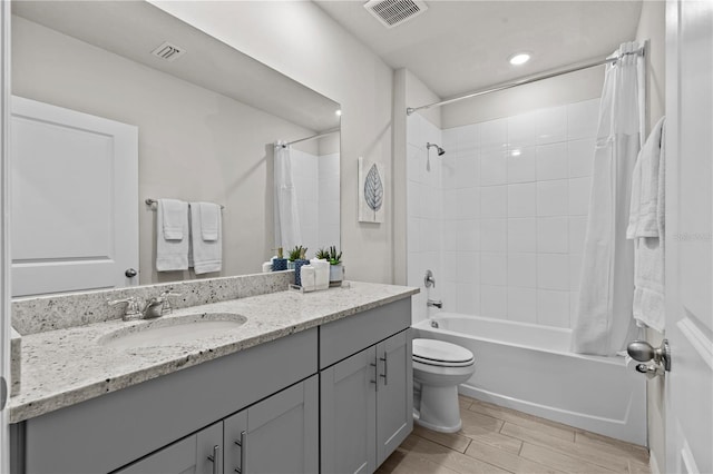 12277 Spring Hill Dr, Spring Hill, FL 34609 - full bath with vanity, shower / bathtub combination with curtain, wood tiled floors, and recessed lighting