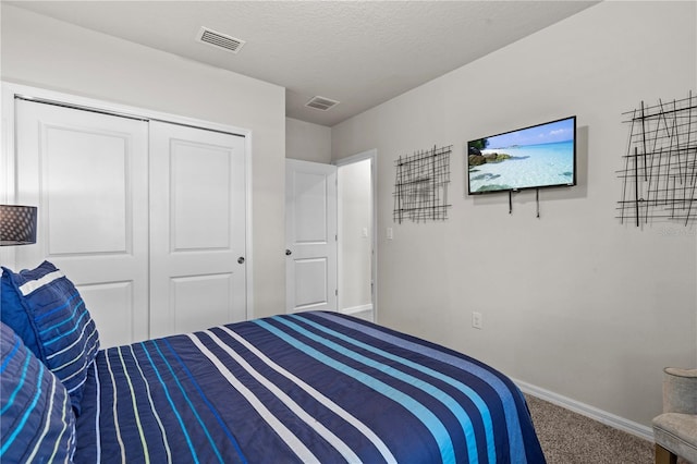 12277 Spring Hill Dr, Spring Hill, FL 34609 - carpeted bedroom with a closet and a textured ceiling