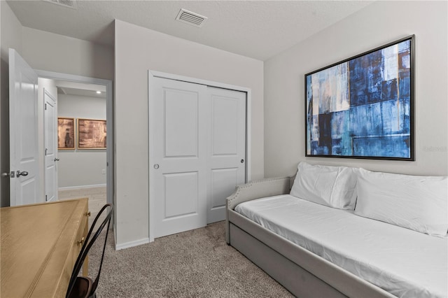 12277 Spring Hill Dr, Spring Hill, FL 34609 - bedroom featuring light carpet and a closet