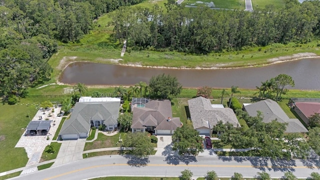 27826 Sora Blvd, Wesley Chapel, FL 33544 - aerial overview of property's location with a large body of water and nearby suburban area