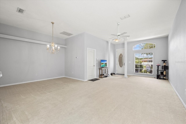 27826 Sora Blvd, Wesley Chapel, FL 33544 - unfurnished living room featuring light colored carpet, a chandelier, and a ceiling fan