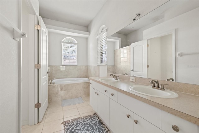 27826 Sora Blvd, Wesley Chapel, FL 33544 - bathroom featuring tile patterned floors, a bath, and double vanity