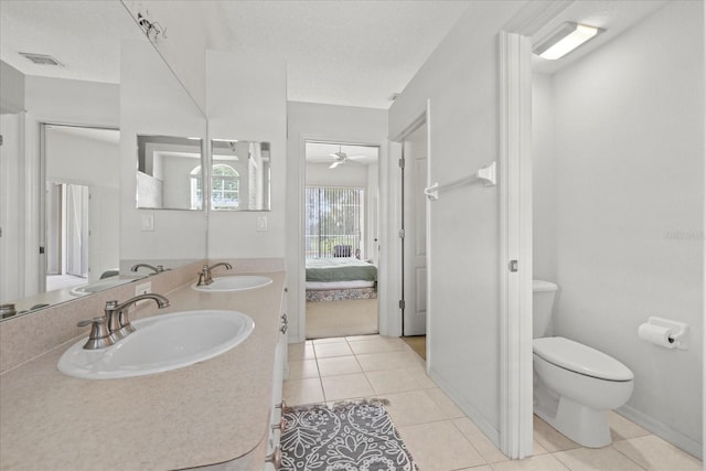 27826 Sora Blvd, Wesley Chapel, FL 33544 - ensuite bathroom with tile patterned flooring, double vanity, and a ceiling fan