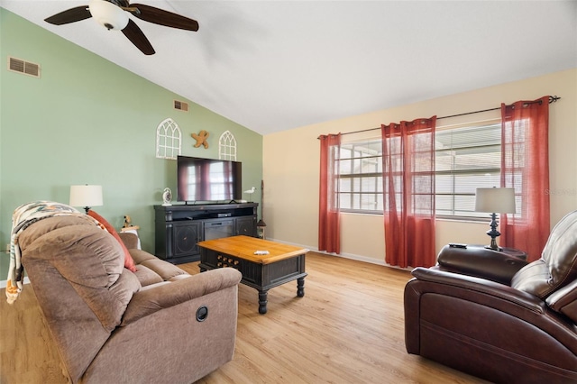 7022 Kingsway Dr, Port Richey, FL 34668 - living room featuring lofted ceiling, a ceiling fan, and light wood-style floors
