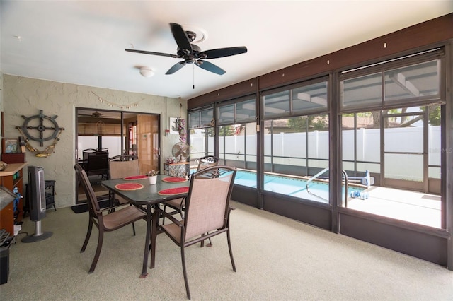7022 Kingsway Dr, Port Richey, FL 34668 - carpeted dining area with a ceiling fan, healthy amount of natural light, and a sunroom