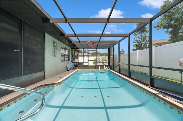 7022 Kingsway Dr, Port Richey, FL 34668 - view of swimming pool with a fenced backyard and glass enclosure
